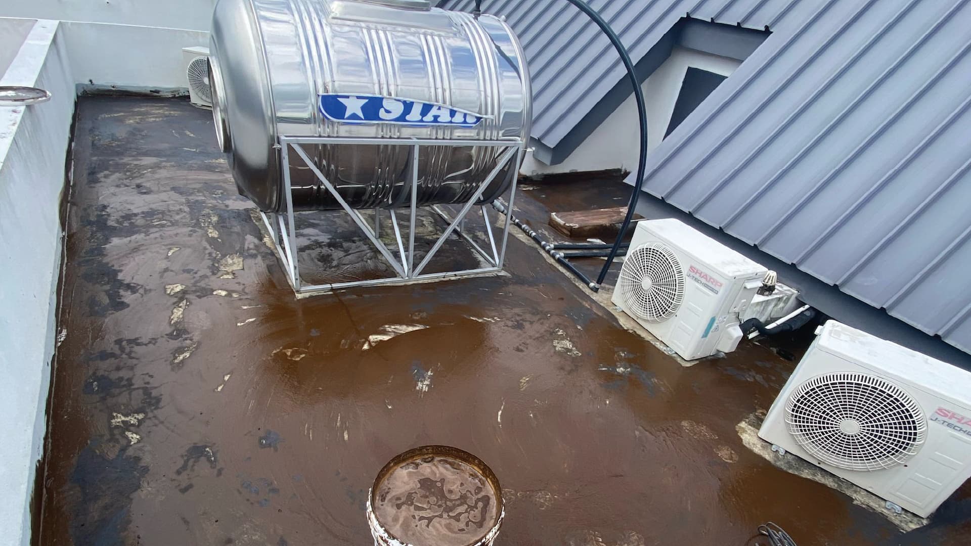 Rooftop watertank 1 torch on system (mineral membrane) before
